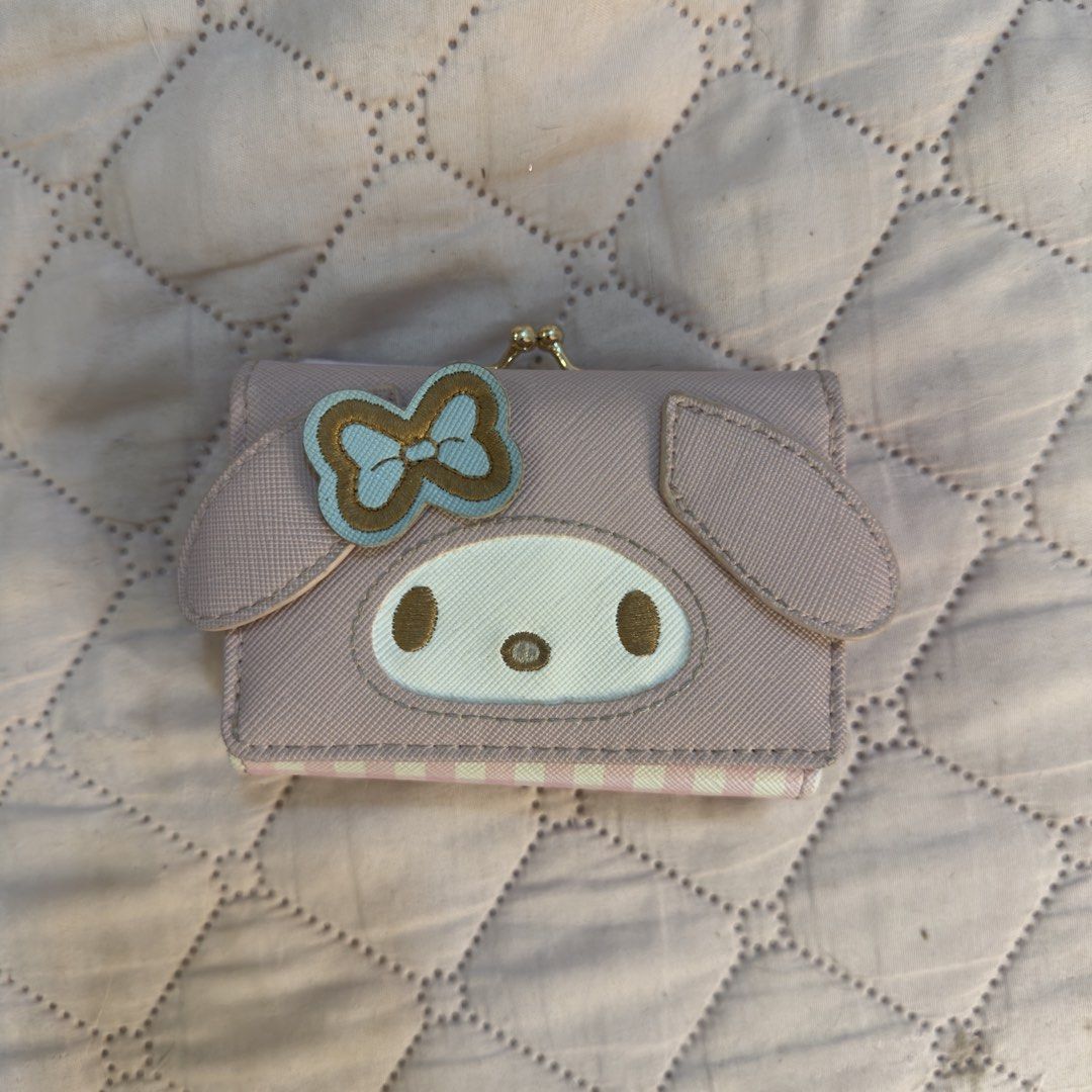 My Melody Pink Tri-Fold Wallet with Clasp (Category: Wallets & Card holders) located in Quezon City. Submitted by allysonne333 (Listing ID 1462571946, Image 1). Description: - Adorable pink My Melody tri-fold wallet. - Features the iconic My Melody face and a cute bow on the front. - Secure clasp closure. - Multiple compartments inside for cards and cash. - Small coin pocket with a snap button closure. - A must-have for any Sanrio or My Melody en