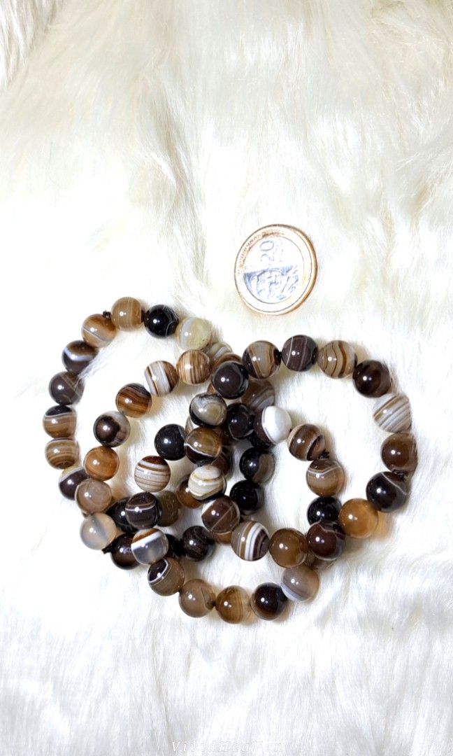 Natural Botswana Agate Stone Beaded Bracelet (Category: Bracelets) located in Quezon City. Submitted by crystallinehaven (Listing ID 1462664272, Image 3). Description: 3 beautiful natural agate stone bracelets. ♦️3 pcs 12mm size ♦️p680 each - Each bead features unique brown, white, and black banding patterns. - Stretchy cord for comfortable and easy wear. - Ideal for stacking with other bracelets or wearing solo. - Makes a wonderful gift idea 💎R