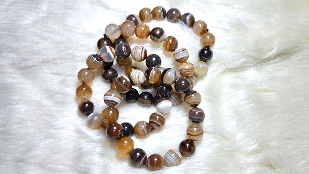 Natural Botswana Agate Stone Beaded Bracelet (Category: Bracelets) located in Quezon City. Submitted by crystallinehaven (Listing ID 1462664272, Image 1). Description: 3 beautiful natural agate stone bracelets. ♦️3 pcs 12mm size ♦️p680 each - Each bead features unique brown, white, and black banding patterns. - Stretchy cord for comfortable and easy wear. - Ideal for stacking with other bracelets or wearing solo. - Makes a wonderful gift idea 💎R