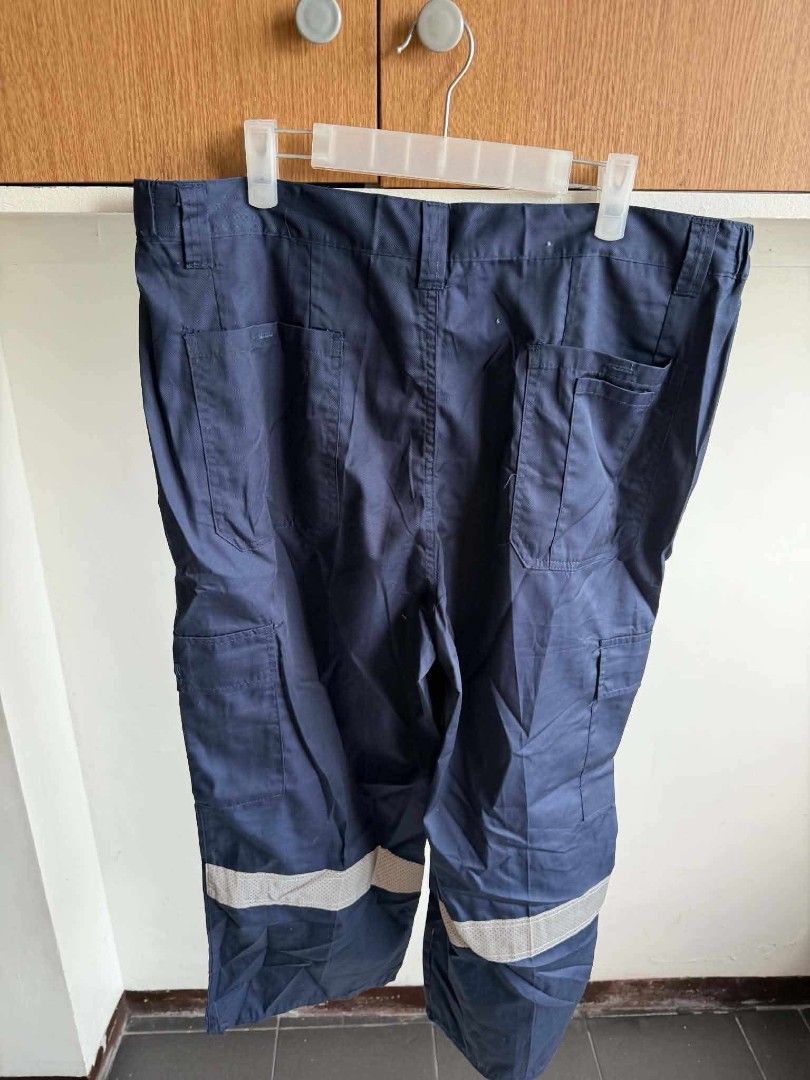 Navy Blue Cargo Work Pants with Reflective Strips (Category: Other Bottoms) located in Manila. Submitted by atozstuff (Listing ID 1462447279, Image 2). Description: - Navy blue cargo work pants - Multiple side pockets - Comfortable elastic waistband - Reflective strips on lower legs for visibility - Durable material - Ideal for work and outdoor activities.