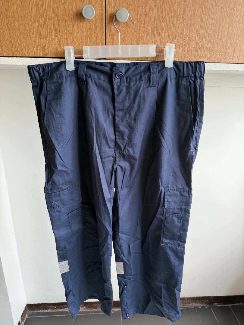 Navy Blue Cargo Work Pants with Reflective Strips (Category: Other Bottoms) located in Manila. Submitted by atozstuff (Listing ID 1462447279, Image 1). Description: - Navy blue cargo work pants - Multiple side pockets - Comfortable elastic waistband - Reflective strips on lower legs for visibility - Durable material - Ideal for work and outdoor activities.