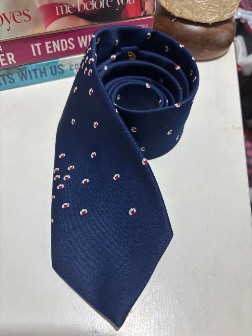 Navy Blue Silk Tie with Red and White Pattern (Category: Ties) located in Baao. Submitted by apr1979 (Listing ID 1462442314, Image 3). Description: - Classic navy blue tie - Features a repeating pattern of small red and white accents - Fabric has a slight sheen - Ideal for formal or business wear - Brand: Original Fashion.