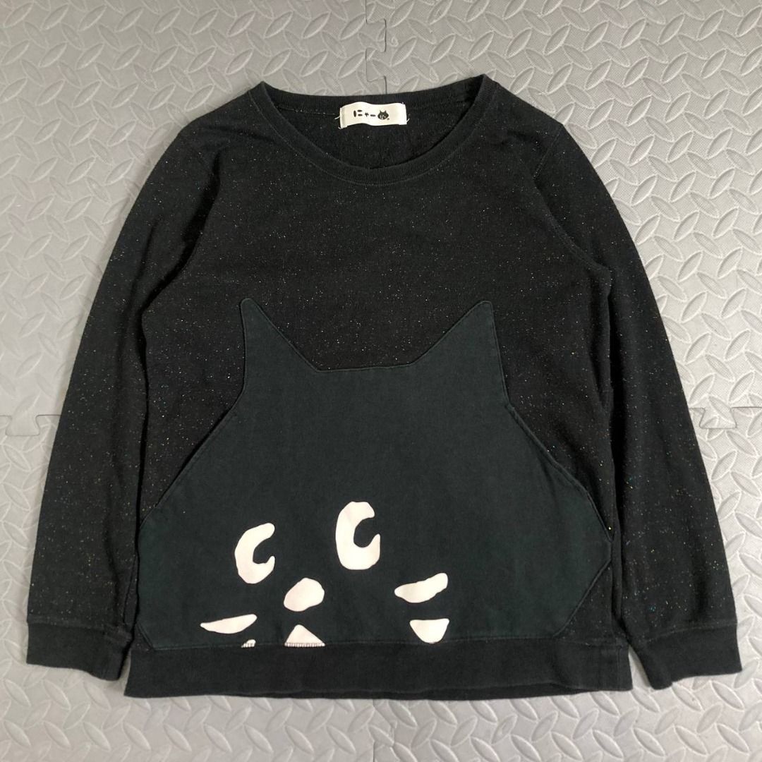 Ne-net – Nyaa Cat Patch Logo Glittered Sweatshirt (Category: Longsleeves) located in Quezon City. Submitted by archived.g (Listing ID 1462481734, Image 1). Description: Ne-net – Nyaa Cat Patch Logo Glittered Sweatshirt - Brand: Ne-net Made in: China Year: Material: Cotton Color: Black Marked size: 2 Sizing: Measurements (laid flat): Shoulders: 15" Sleeves: 21.5” Bust: 18.5” Waist: 18.5" Length: 23.5” Color rating: 9/10 Condition: 9/10 Flaws: mini