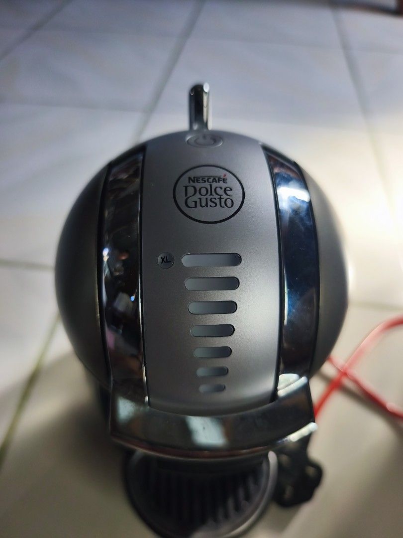 Nescafé Dolce Gusto Coffee Machine (Category: Coffee Machines & Makers) located in Manila. Submitted by mrs.jane08 (Listing ID 1462484400, Image 3). Description: - Nescafé Dolce Gusto coffee machine - Compact design, fits easily on your counter - Easy to use for your daily coffee fix - Includes red power cord - Perfect for quick and convenient brews.