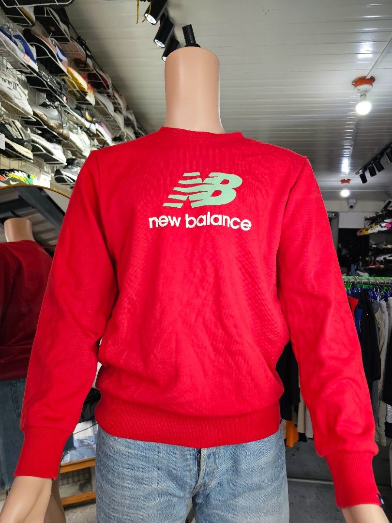 New Balance crewneck sweatshirt (Category: Coats, Jackets and Outerwear) located in Baguio. Submitted by kayeonlineshop (Listing ID 1462563221, Image 2). Description: -vibrant red New Balance crewneck sweatshirt featuring a distinctive green and white stacked logo on the chest. -Measurements included in the photos.