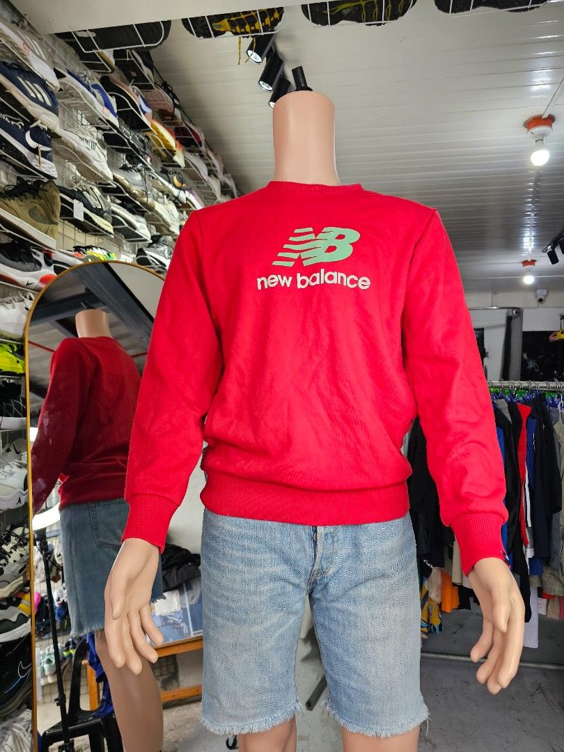 New Balance crewneck sweatshirt (Category: Coats, Jackets and Outerwear) located in Baguio. Submitted by kayeonlineshop (Listing ID 1462563221, Image 1). Description: -vibrant red New Balance crewneck sweatshirt featuring a distinctive green and white stacked logo on the chest. -Measurements included in the photos.