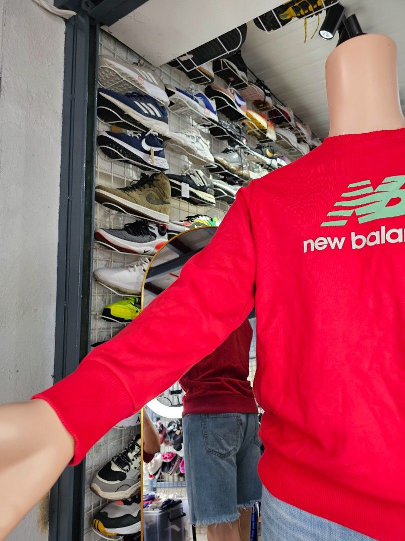 New Balance crewneck sweatshirt (Category: Coats, Jackets and Outerwear) located in Baguio. Submitted by kayeonlineshop (Listing ID 1462563221, Image 3). Description: -vibrant red New Balance crewneck sweatshirt featuring a distinctive green and white stacked logo on the chest. -Measurements included in the photos.