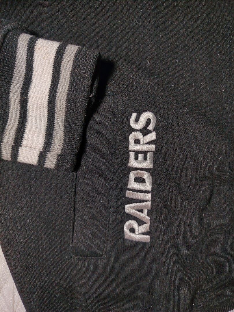 NFL Las Vegas Raiders Varsity Jacket XL (Category: Coats, Jackets and Outerwear) located in Manila. Submitted by charlize.kate2026 (Listing ID 1462471133, Image 3). Description: - Black and grey Las Vegas Raiders varsity jacket - Features Raiders logo on chest - 'Raiders' embroidered on sleeve - Number '60' on the front - NFL Team Apparel tag - Ribbed cuffs and collar for a snug fit - Classic snap button closure.