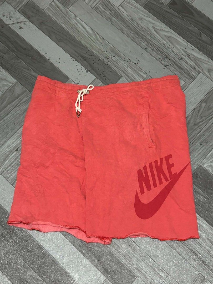 Nike Coral Red Athletic Shorts (Category: Shorts) located in Manila. Submitted by tantmzn (Listing ID 1462656159, Image 1). Description: - Coral red Nike shorts - Elastic waistband with drawstring - Convenient side pocket - Bold large Nike logo graphic on the side - Trendy raw hem - Ideal for both lounging and workouts FOR SALE!! NIKE ALUMNI DIMES: WAIST 36 LENGTH 20 NO ISSUE DM FOR MORE DETAILS .