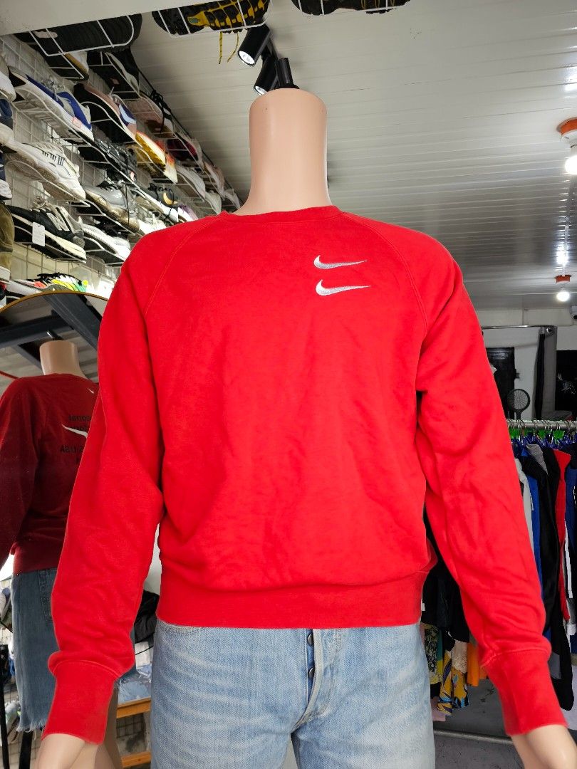 Nike crewneck sweatshirt (Category: Coats, Jackets and Outerwear) located in Baguio. Submitted by kayeonlineshop (Listing ID 1462559194, Image 2). Description: -red Nike crewneck sweatshirt featuring a distinctive double swoosh embroidered logo on the upper chest -measurements included in the photos.