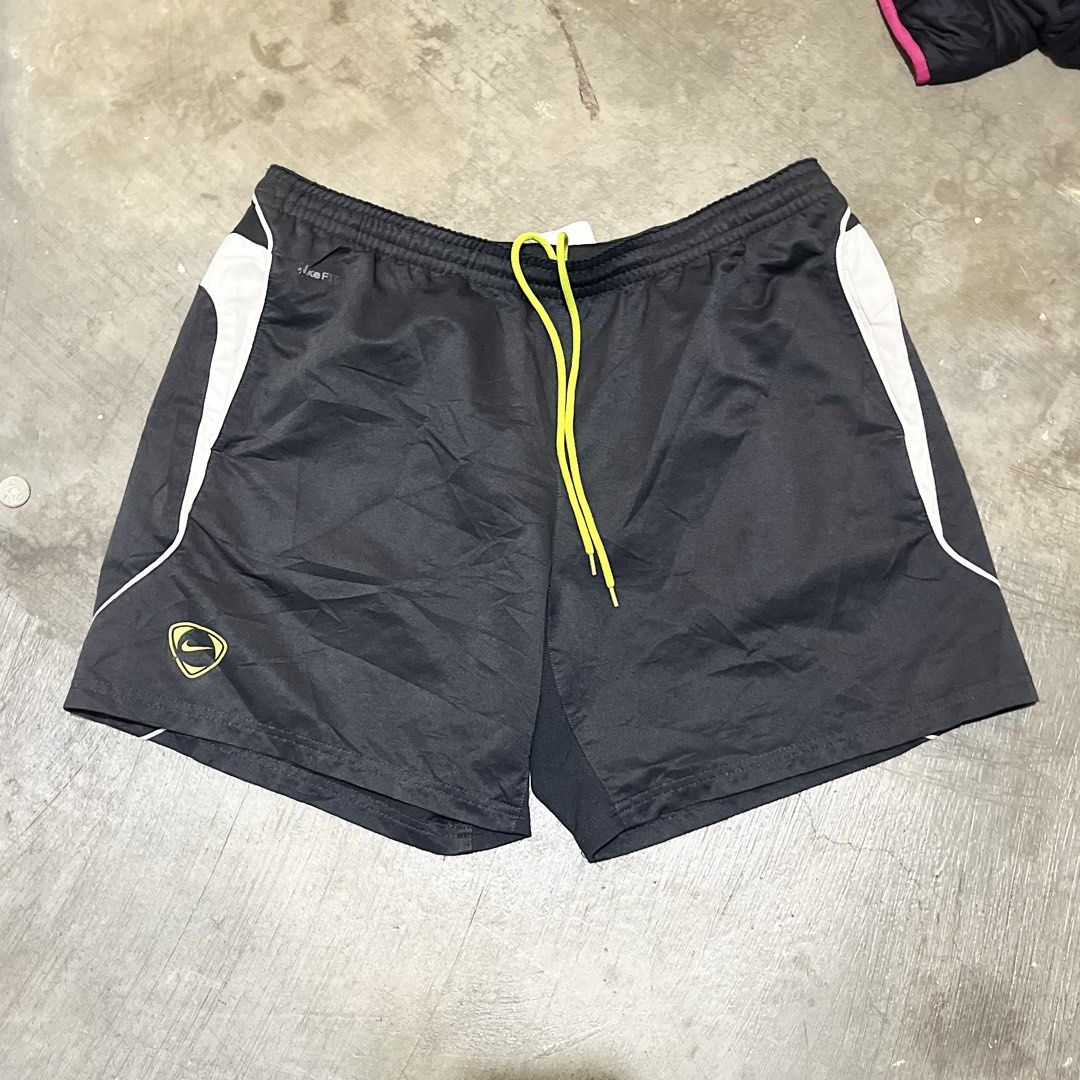 Nike Dri-FIT Black Athletic Shorts (Category: Activewear) located in Manila. Submitted by jezrathrift (Listing ID 1462673392, Image 1). Description: - Black Nike Dri-FIT shorts - Yellow drawstring - White accents on the sides - Ideal for running or training - Comfortable and lightweight material - Features Nike logo on the left leg.
