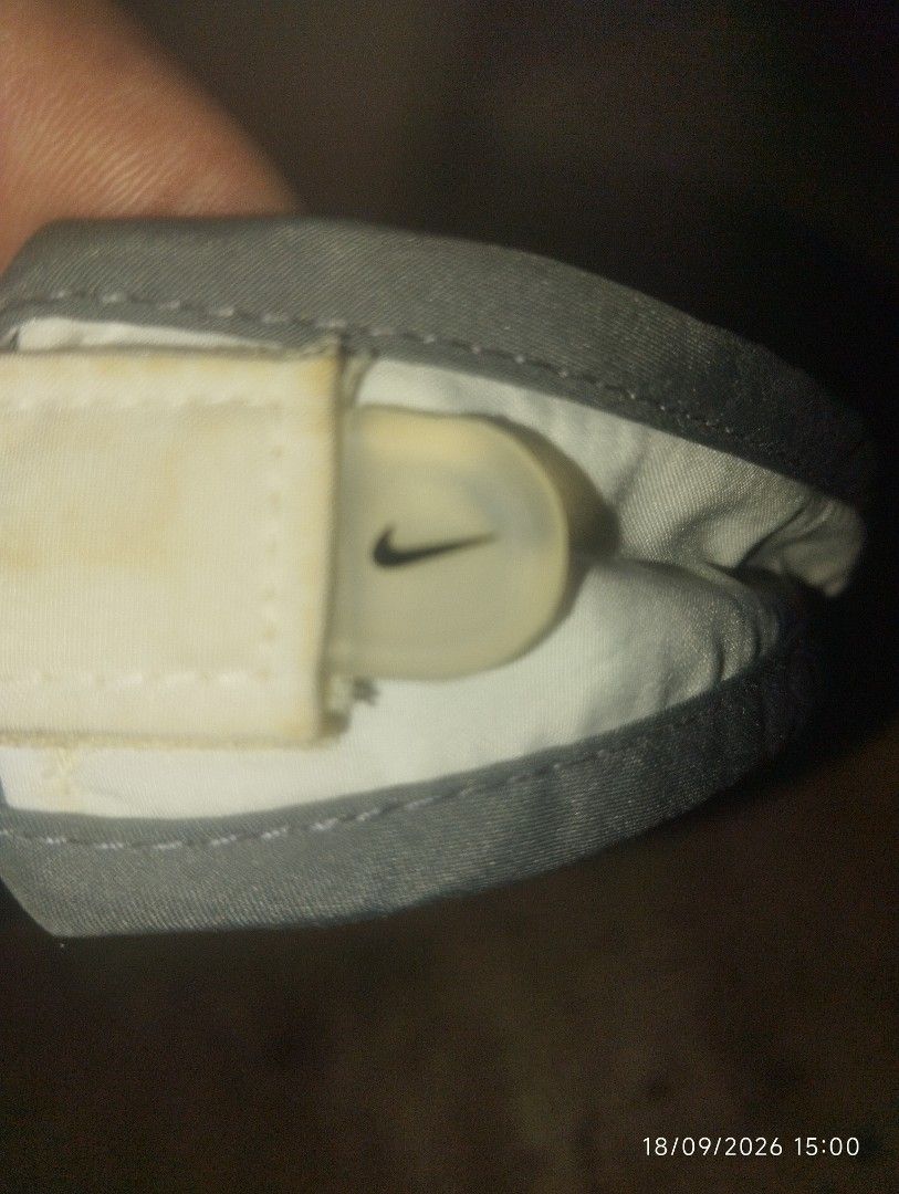 Nike Fit White Visor with Grey Trim (Category: Activewear) located in Manila. Submitted by thriftjepo01336 (Listing ID 1462519873, Image 2). Description: - White Nike visor with grey trim - Features Nike Fit logo on the side - Adjustable strap at the back for a secure fit - Ideal for sports activities or protecting your eyes from the sun - Lightweight and easy to wear.
