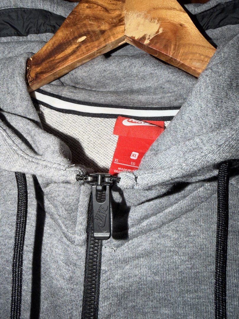 Nike Grey Full Zip Hoodie Jacket (Category: Coats, Jackets and Outerwear) located in Manila. Submitted by m.flojo (Listing ID 1462508761, Image 3). Description: - Grey Nike hoodie - Full zip closure - Nike logo on chest - Hood with drawstrings - Size: XL - Ideal for casual wear or sports.