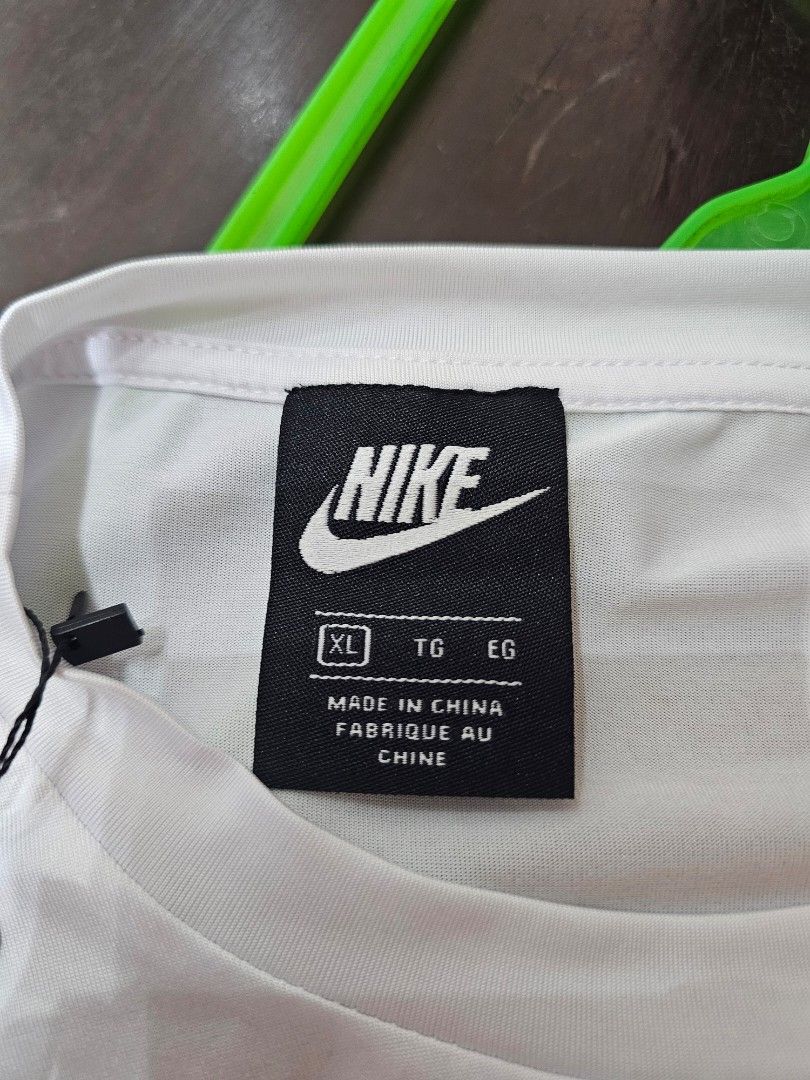 Nike long sleeve (Category: Coats, Jackets and Outerwear) located in Baguio. Submitted by kayeonlineshop (Listing ID 1462504575, Image 3). Description: -white long-sleeve Nike shirt featuring a small, multicolored patterned chest logo -measurements included in the photos.