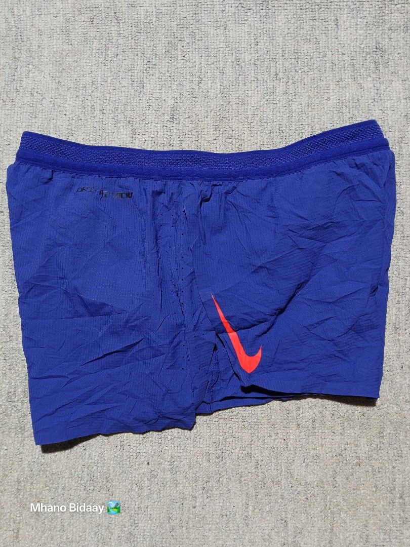 Nike Men's AeroSwift Split Running Shorts (Category: Activewear) located in Valencia. Submitted by mhano_bidaay_outdoors_218 (Listing ID 1462557915, Image 3). Description: - Nike Men's AeroSwift Split Shorts - Size: Small (fits waistline 28"-30") - Lightweight and quick-drying fabric - Excellent overall condition - Color rating: 9.9/10 - Measurements: Length 10", Leg Opening 13".