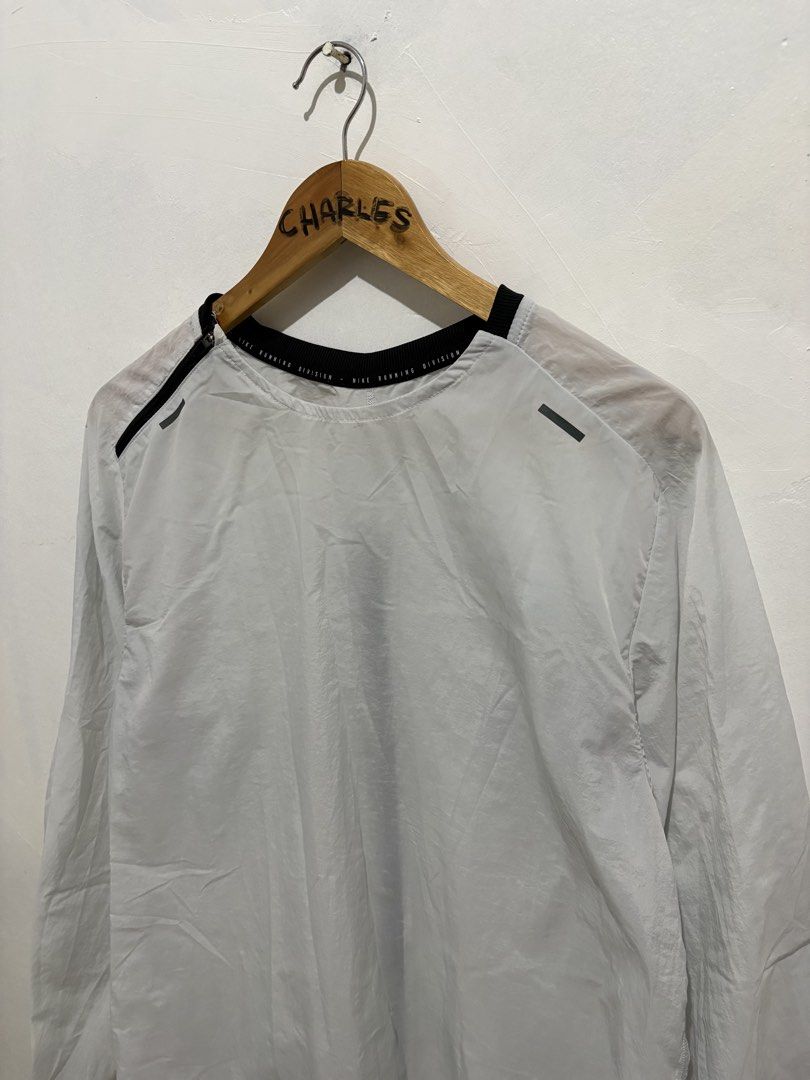 Nike Running Division Lightweight Jacket L (Category: Coats, Jackets and Outerwear) located in Cabanatuan. Submitted by chingweyyy (Listing ID 1462619331, Image 3). Description: - Nike Running Division Jacket - Lightweight material, ideal for running - Size: Large (L) - Made in Vietnam - Please check photos for detailed condition - 21 Width x 27 Length - No Issue.