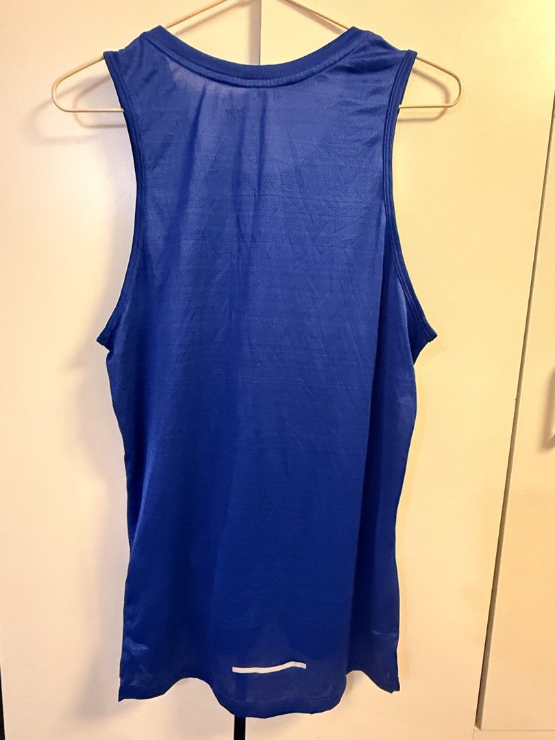 Nike Running Tank Top Blue Men's (Category: Activewear) located in Makati City. Submitted by aeboi08 (Listing ID 1462621999, Image 2). Description: - Blue Nike running tank top - Lightweight and breathable fabric - Reflective detail on back hem - Ideal for gym sessions and outdoor runs - Comfortable fit - dimensions 18x27 (Small).