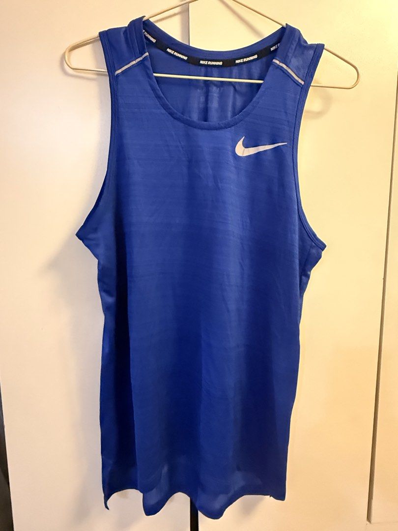 Nike Running Tank Top Blue Men's (Category: Activewear) located in Makati City. Submitted by aeboi08 (Listing ID 1462621999, Image 1). Description: - Blue Nike running tank top - Lightweight and breathable fabric - Reflective detail on back hem - Ideal for gym sessions and outdoor runs - Comfortable fit - dimensions 18x27 (Small).
