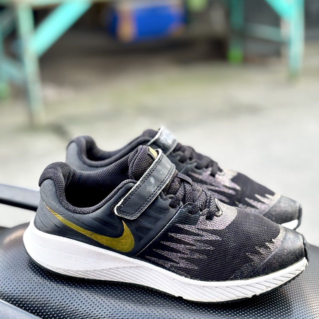 Nike Star Runner Black Gold (Category: Sneakers) located in San Fernando. Submitted by kickslocker (Listing ID 1462444050, Image 2). Description: - Nike Star Runner shoes for kids - Color: Black with gold accents - Size: 5 Women's / 35 Euro / 22cm - Condition: Very good - Perfect for comfy everyday wear!.