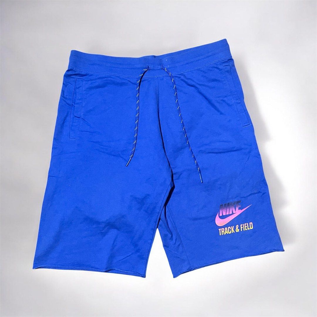 Nike Track & Field Blue Athletic Shorts (Category: Shorts) located in Munoz. Submitted by bb_jimbo0 (Listing ID 1462473524, Image 1). Description: - Blue Nike shorts - Drawstring waist - Nike Track & Field logo on lower right leg - Raw hem finish - Ideal for workouts or casual wear.