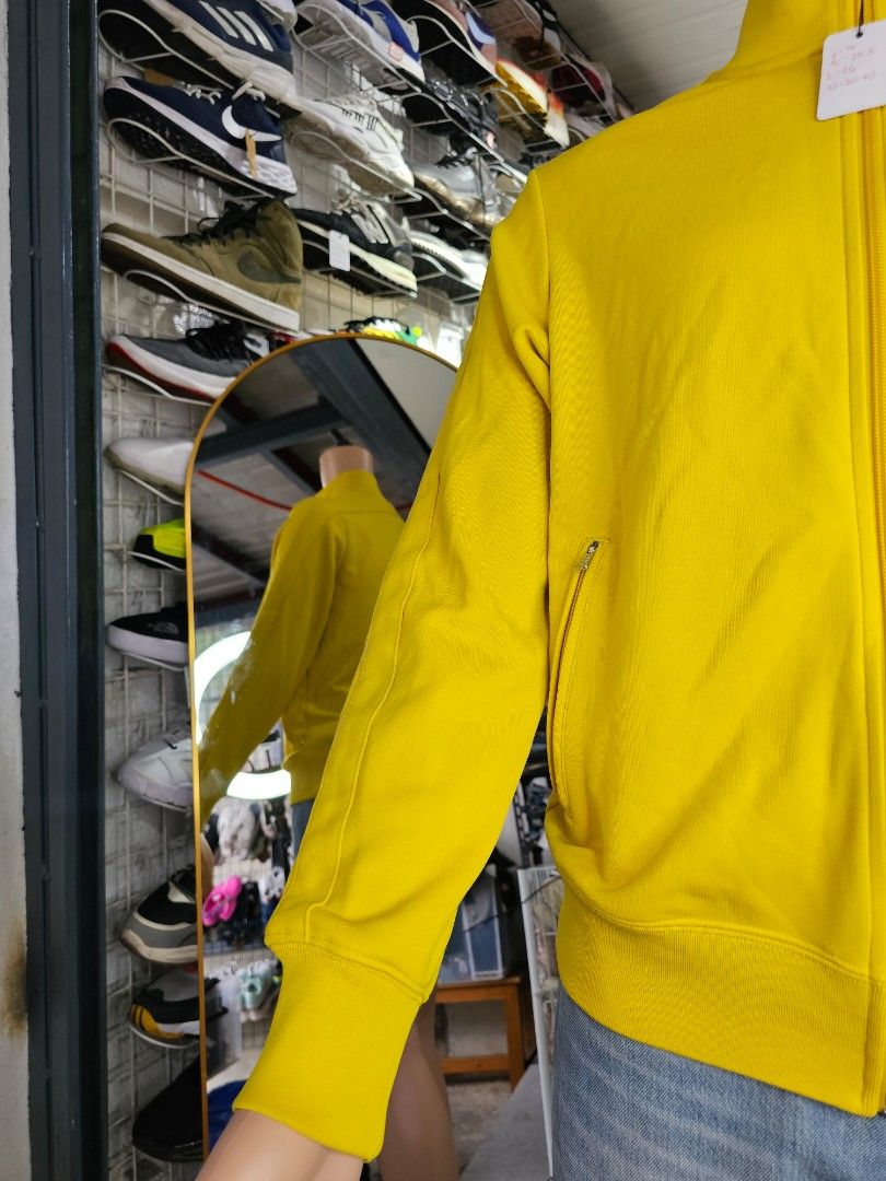 Nike zip-up track jacket (Category: Coats, Jackets and Outerwear) located in Baguio. Submitted by kayeonlineshop (Listing ID 1462461689, Image 3). Description: -yellow Nike zip-up track jacket featuring a high stand-up collar and a small embroidered logo on the chest.