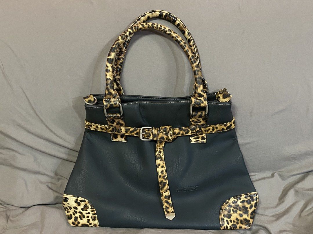 Nine West Leopard Office Bag (Category: Shoulder Bags) located in Rizal. Submitted by ciciloved (Listing ID 1462620086, Image 1). Description: Authentic from US:) Comes with long strap. Issue: Minimal leather cracks on handle and back pocket zipper not working. See photos for details. Payment first to reserve. 📍Cainta Rizal 🛵 J&t or Lalamove only 💳 Strictly via GoTyme only.