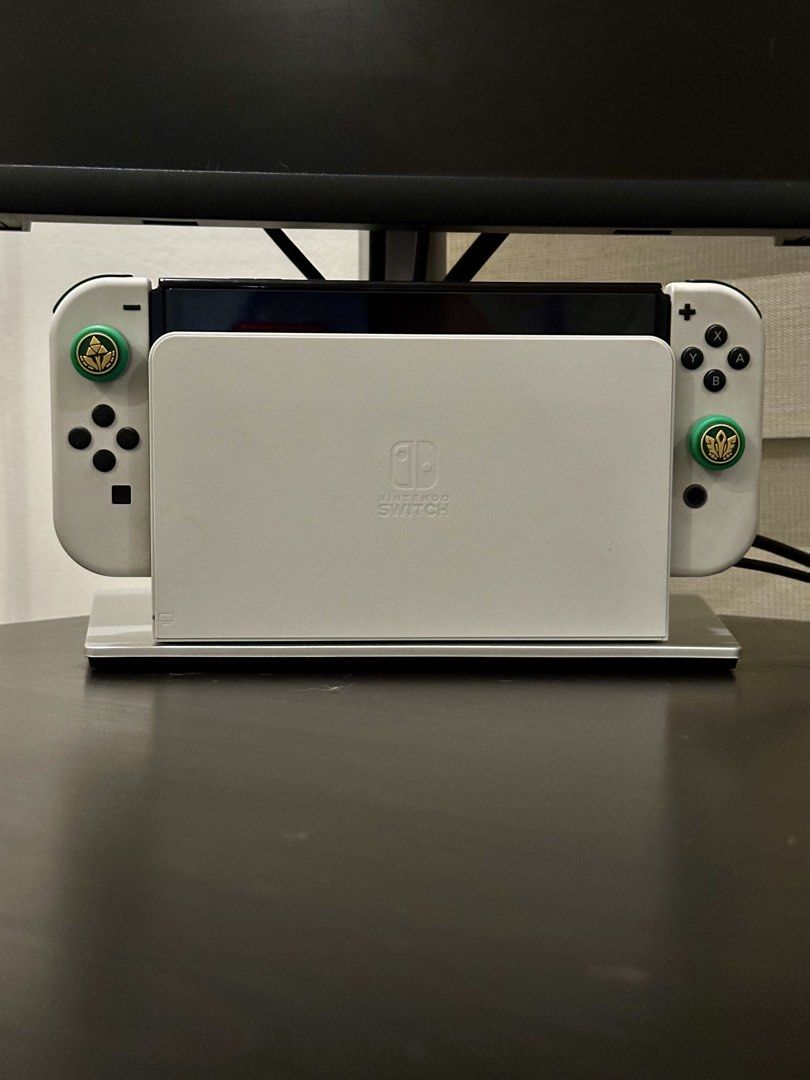 Nintendo Switch OLED - White (Category: Nintendo) located in Manila. Submitted by fuzzyeyebrows (Listing ID 1462450896, Image 1). Description: - Bought from the Nintendo Store last March 2026. Unit and accessories are in pristine condition - Price is negotiable. Feel free to inquire if interested - Bnew units go now for 22k - Barely used, good as new - Definitely no issues or defects - Covered with tempered glass - Comes with the default box incl