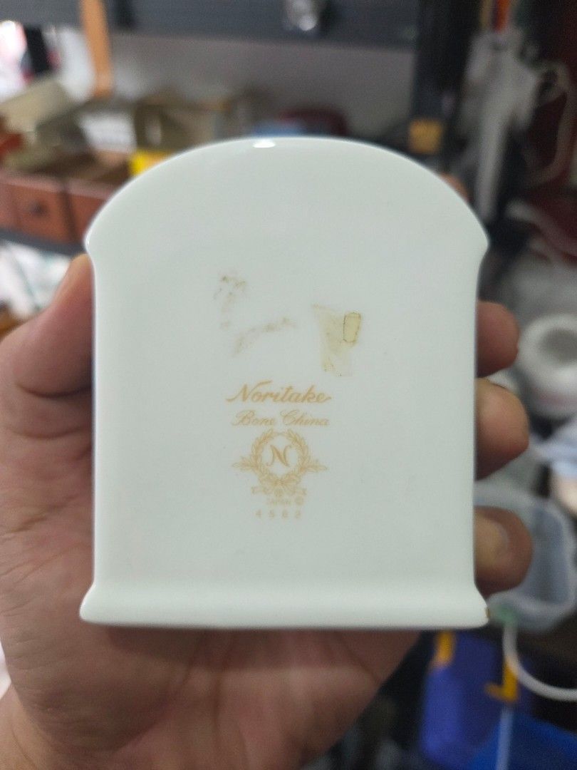 Noritake Bone China Blue Floral Table Clock (Category: Clocks) located in Paranaque City. Submitted by antik-antik (Listing ID 1462531264, Image 2). Description: - Authentic Noritake bone china table clock - Classic blue floral pattern on white porcelain - Elegant clock face with Roman numerals and gold trim - Beautiful decorative piece for any desk or shelf - Battery operated - Approximately 4 inches tall.