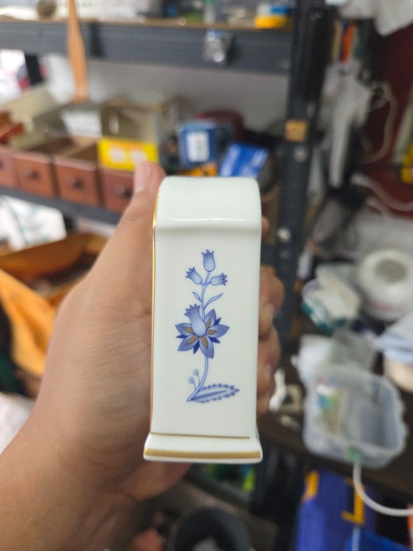 Noritake Bone China Blue Floral Table Clock (Category: Clocks) located in Paranaque City. Submitted by antik-antik (Listing ID 1462531264, Image 3). Description: - Authentic Noritake bone china table clock - Classic blue floral pattern on white porcelain - Elegant clock face with Roman numerals and gold trim - Beautiful decorative piece for any desk or shelf - Battery operated - Approximately 4 inches tall.