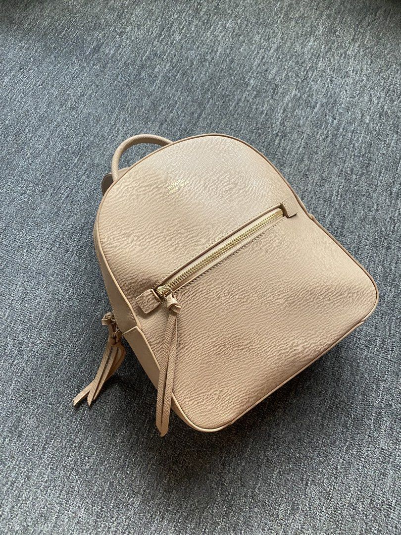 Nude Leather Mini Backpack (Category: Backpacks) located in Makati City. Submitted by clutterfree.life (Listing ID 1462515136, Image 1). Description: - Color: Nude - Size: 11” x 10” x 3” - Has internal pockets, one with zipper - Has zippered front pocket - Has slight discoloration on straps because of metal oxidation. Used once. .