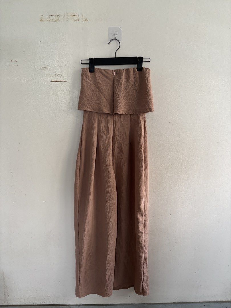 Nude Strapless dress (Category: Jumpsuits) located in Muntinlupa City. Submitted by jc444_ (Listing ID 1462596181, Image 3). Description: -Used once; bought for ₱500 - Brown strapless jumpsuit - Ruffle detail at the top - Wide leg pants - Textured fabric - Back zipper closure - Ideal for night outs or special occasions.