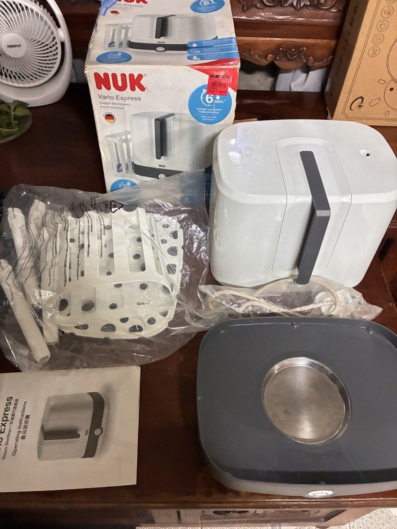 NUK Vario Express Steam Sterilizer (Category: Breastfeeding & Bottle Feeding) located in Taguig. Submitted by badoodles15 (Listing ID 1462457635, Image 3). Description: - NUK Vario Express Steam Sterilizer - Sterilizes in just 6 minutes - Chemical-free steam sterilization - Maintains sterility for 24 hours after unpacking - Flexible and expandable to fit various bottles and accessories - Developed in Germany.