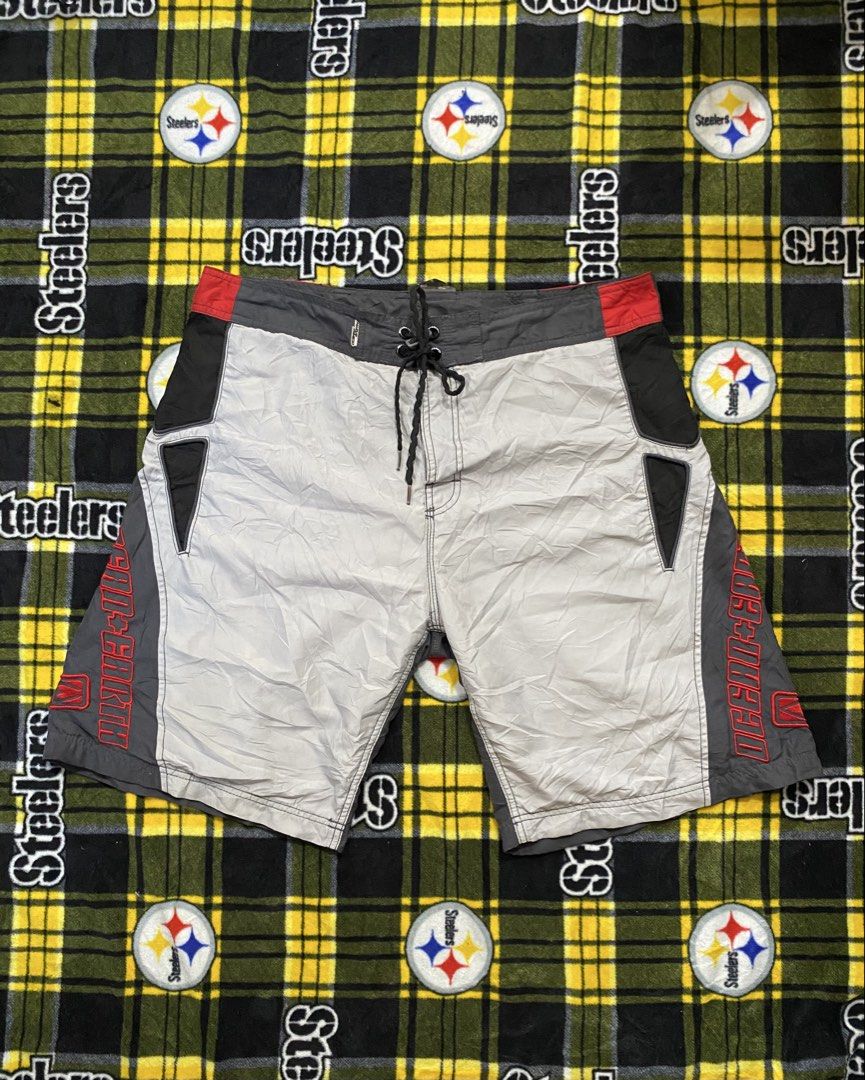 Ocean Earth, Board shorts (Category: Swim Trunks & Board Shorts) located in Cavite. Submitted by jc_thrift95 (Listing ID 1462640239, Image 1). Description: - a pair of vintage multi-panel board shorts featuring a gray, white, black, and red colorway with prominent red embroidered lettering that appears to read “OCEAN+EARTH”. - Product Type: Men’s board shorts / swim trunks. - Visual Details: Drawstring waist, snap button closure, and contrast col