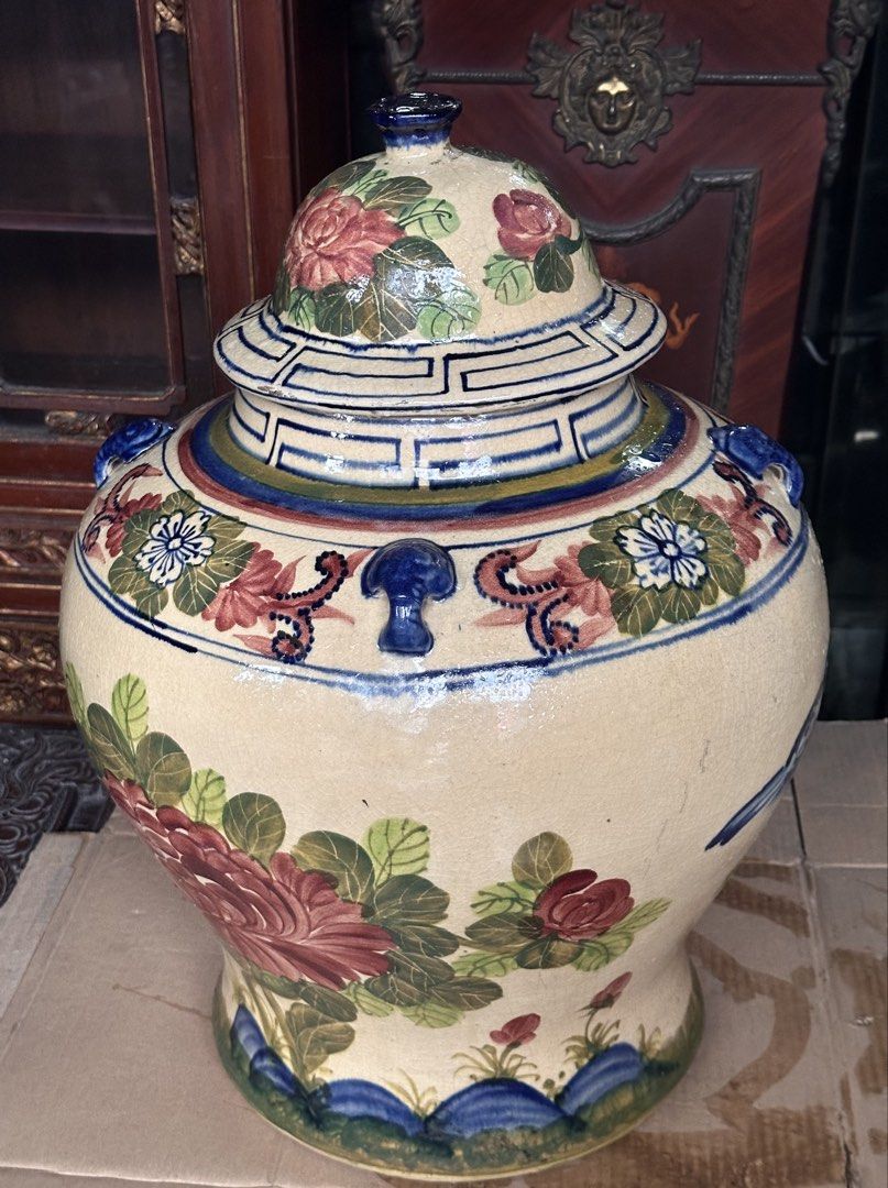 Old Large Pukaw Jar (Category: Vases & Decorative Bowls) located in Quezon City. Submitted by anjherga27 (Listing ID 1462560201, Image 2). Description: - Beautiful vintage ceramic jar with lid. - Hand-painted with vibrant floral designs and a charming blue bird. - Rich colors and intricate details. - Great for home decor or as a statement piece. - Measures approximately [insert height] tall. - Unique and eye-catching..