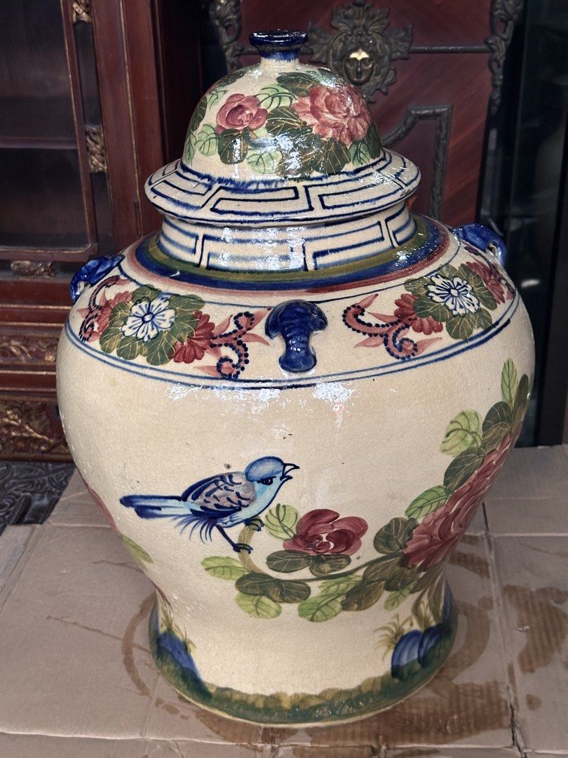 Old Large Pukaw Jar (Category: Vases & Decorative Bowls) located in Quezon City. Submitted by anjherga27 (Listing ID 1462560201, Image 3). Description: - Beautiful vintage ceramic jar with lid. - Hand-painted with vibrant floral designs and a charming blue bird. - Rich colors and intricate details. - Great for home decor or as a statement piece. - Measures approximately [insert height] tall. - Unique and eye-catching..