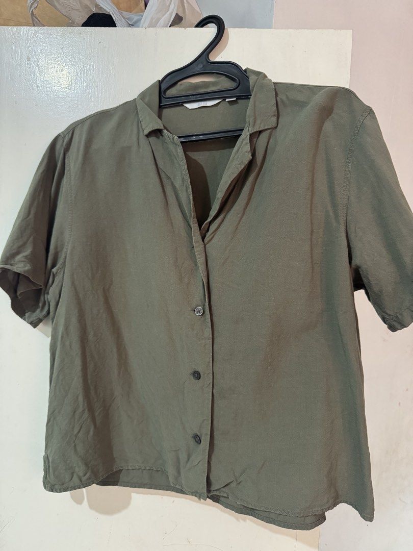 Olive Green Short Sleeve Collared Button-Up Shirt (Category: Shirts) located in Manila. Submitted by freehorse.624311 (Listing ID 1462477635, Image 1). Description: - Olive green short sleeve shirt - Collared neckline with button-up front - Unique crinkled fabric texture - Relaxed fit for comfort - Ideal for casual outfits.