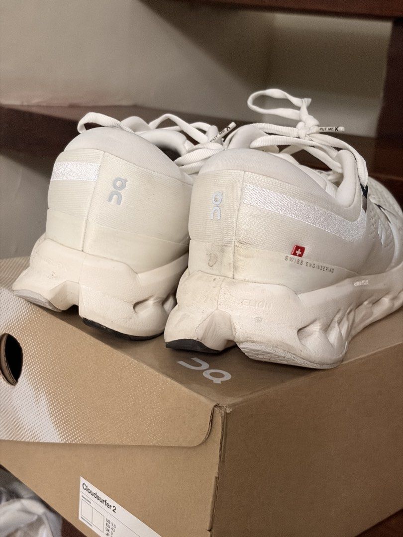 On Cloudsurfer 2 Running Shoes (Category: Sneakers) located in Quezon City. Submitted by rofervic (Listing ID 1462619456, Image 3). Description: - On Cloudsurfer 2 Running Shoes - Color: White - Size: US Men's 9.5 - Original box included - Condition: Minor scuffs on soles and uppers from normal wear, still has plenty of life left - Ideal for: Everyday runs and casual wear.