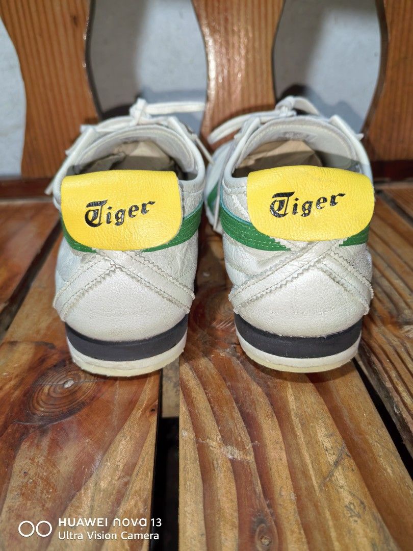 Onitsuka Tiger super deluxe Original (Category: Sneakers) located in Cebu City. Submitted by abellarces30419 (Listing ID 1462462490, Image 3). Description: - COnitsuka Tiger Mexico 66 sneakers Super deluxe Original 37.5EU 23.5CM fit 6.5 Womens 5mens - White leather with iconic green and red stripes - Yellow heel tabs with 'Tiger' branding - Soles show some wear but have plenty of grip remaining - Original laces included - Ideal for casual wear or