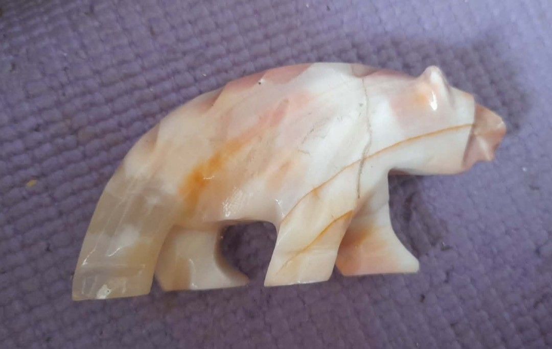 Onyx bear decor (Category: Other Home Decor) located in Quezon City. Submitted by verybountiful (Listing ID 1462444379, Image 1). Description: Approximatrly 3" long, possibly longer, didn't have a measuring tape to measure it, but there's a regular pair of eyeglasses as reference to size. Location: Malate, Manila. MOP RCBC, Landbank or gcash. RFS: Decluttering..
