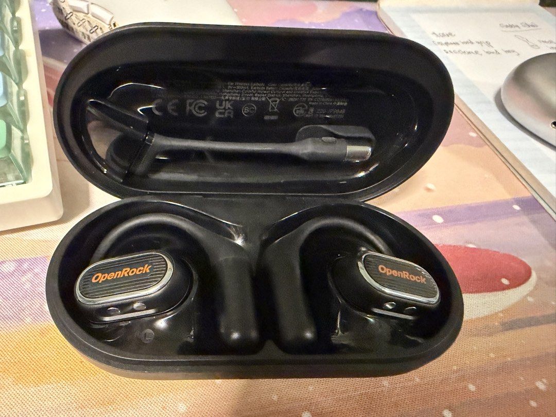 OpenRock Wireless Earbuds with Charging Case (Category: Earphones) located in Manila. Submitted by mcasensi (Listing ID 1462566539, Image 2). Description: - OpenRock wireless earbuds - Color: Black with orange accents - Includes charging case and charging cable - Ideal for workouts and daily use - Tested and confirmed working.