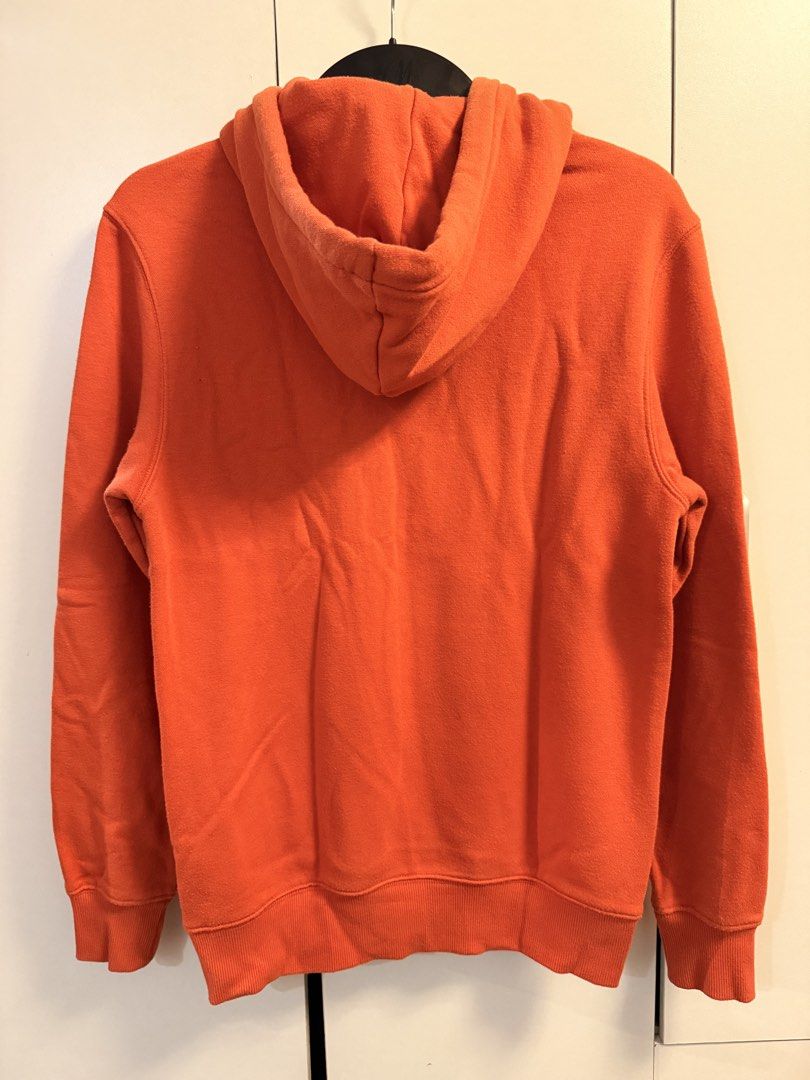 H&M Orange Hoodie (Category: Coats, Jackets and Outerwear) located in Makati City. Submitted by aeboi08 (Listing ID 1462629679, Image 2). Description: - H&M Cozy orange hoodie - XS/S - Features a cool mountain graphic on the chest - Convenient front pocket - Adjustable hood with drawstrings - Ideal for casual and warm wear.
