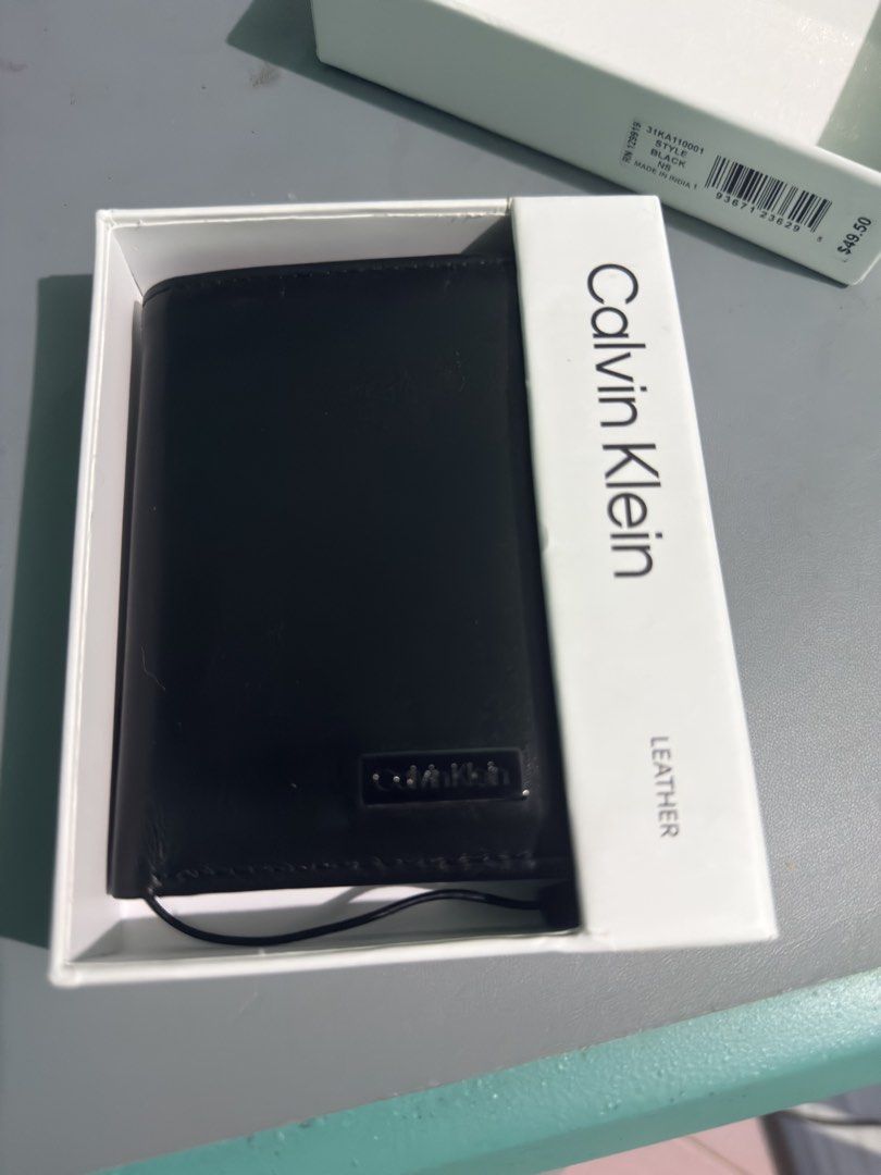 Original / Authentic Calvin Klein slim trifold wallet (Category: Wallets & Card Holders) located in Marilao. Submitted by chloedianela (Listing ID 1462587271, Image 3). Description: Original / Authenthic Calvin Klein Trifold Wallet Genuine Leather Good as New RFID No issue comes with Box RFS: Decluttering Selling for PHP 1500.