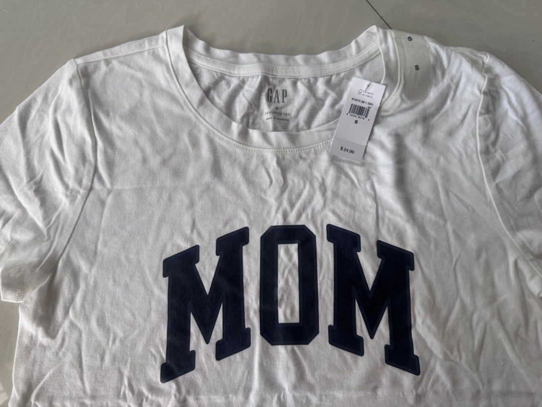 Original GAP “MOM” print shirt (Category: Shirts) located in Paranaque City. Submitted by happymommy2828 (Listing ID 1462471238, Image 3). Description: Original with tag and size sticker! -Size Small -Gusot lang but still can be given as a gift to someone :) .