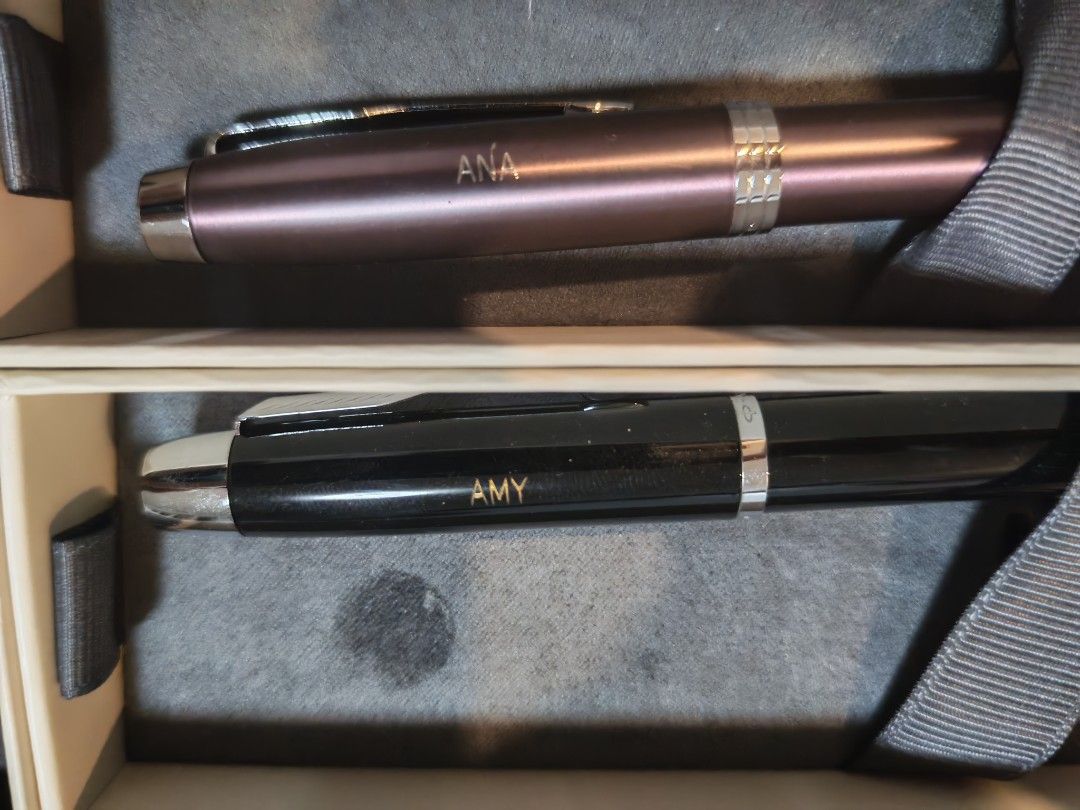 Parker IM Pens - Set of 2 (Category: Stationery & School Supplies) located in Manila. Submitted by GentleGiant (Listing ID 1462643733, Image 2). Description: - Set of 2 Parker IM pens - One Rose Gold pen engraved with 'ANA' - One Black pen engraved with 'AMY' -600 each - Both pens engraved with 'CHEO SOFTWARE TESTING' - Includes original box - Ideal for gifting or personal use.