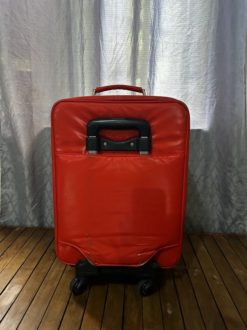 PASSARDI Carry on Luggage (Category: Luggage) located in Taguig. Submitted by ghiebow06 (Listing ID 1462613077, Image 3). Description: Dimensions: H- 21 W- 14 D- 7 Issue: scratches - Features a cute bear design on the front pocket - Retractable handle and wheels for easy transport - Shows some scuffs and wear marks on exterior (bottom/corners) - Zippers are functional - Ideal for travel.