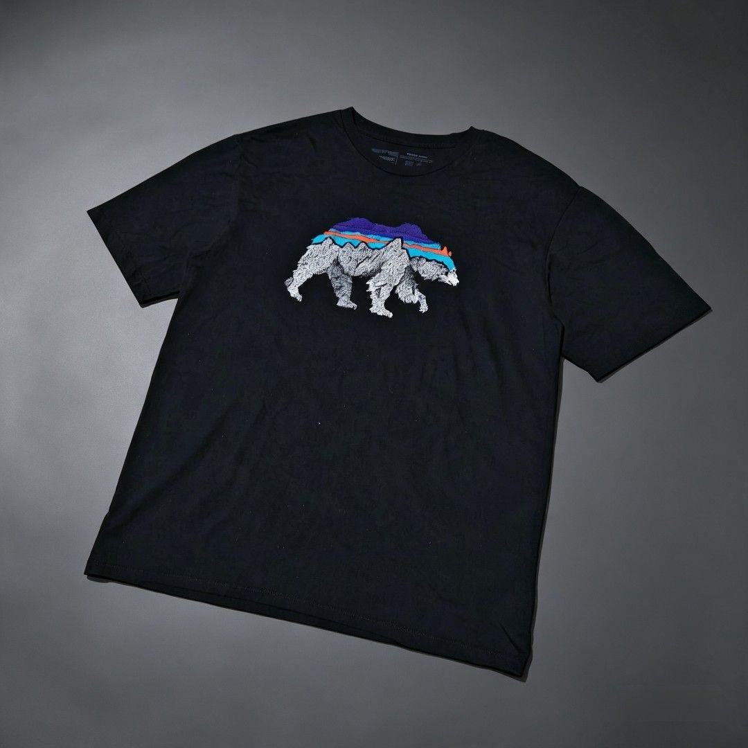 Patagonia - Back for Good Organic Cotton (Category: Tshirts & Polo Shirts ) located in Camalig. Submitted by 50thrifty (Listing ID 1462624482, Image 1). Description: Size : 22x28 M-L This is a black Patagonia Men's Back For Good Organic T-Shirt featuring a detailed graphic of a bear with a mountain backdrop on the front.