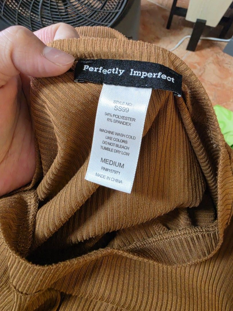 Perfectly Imperfect Ribbed Cropped Top Size Medium (Category: Sleeveless) located in Paranaque City. Submitted by franinnashop (Listing ID 1462510314, Image 3). Description: - Brown ribbed cropped top - Brand: Perfectly Imperfect - Style: Short sleeves, crew neck - Material: Polyester and spandex blend - Versatile: Easy to pair with jeans or skirts - Occasion: Great for casual wear declutter medium paranaque city.