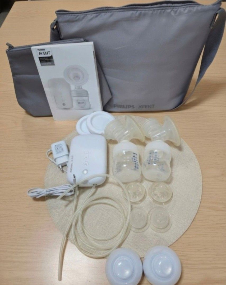 Philips Avent Electric Breast Pump with Bag (Category: Breastfeeding & Bottle Feeding) located in Quezon City. Submitted by jazz1718 (Listing ID 1462553871, Image 1). Description: - Philips Avent electric breast pump set - Includes: - Pump unit - Two bottles - Two breast shields - Spare parts - Carrying bag - Original manual - Power adapter - All components shown in the image..