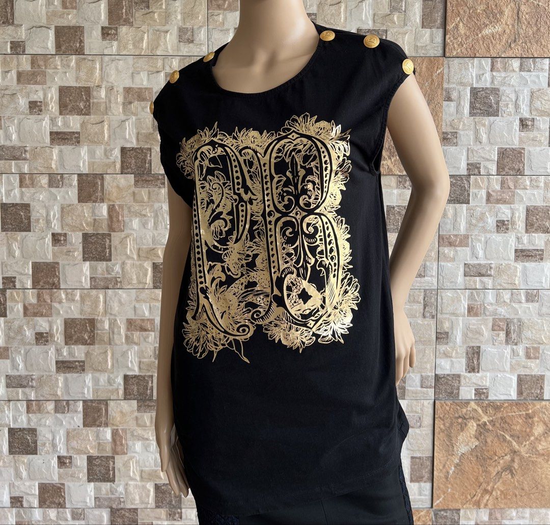 PIERRE BALMAIN - METAL BUTTONS DESIGN SLEEVELESS (Category: Sleeveless) located in Bacolod City. Submitted by timelessbyjosh (Listing ID 1461728038, Image 1). Description: BEST FOR Y2K OUTFITS SIZE : 46 ACTUAL COLOR : BLACK & GOLD COLOR RATE : 10 OUT OF 10 CONDITION : NEAR NEW MATERIAL : 100 % COTTON MADE IN : MOLDOVA FLAWS : NONE DIMENSIONS LENGTH - 29. 5 WIDTH ( ARMPIT TO ARMPIT )- 19 MEASUREMENT TAKEN WHILE LAYING FLAT. PLEASE COMPARE THE MEAS