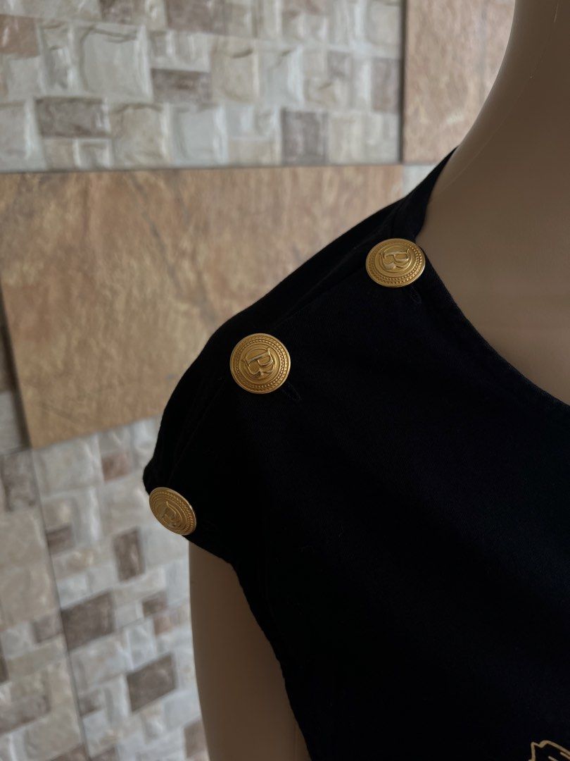 PIERRE BALMAIN - METAL BUTTONS DESIGN SLEEVELESS (Category: Sleeveless) located in Bacolod City. Submitted by timelessbyjosh (Listing ID 1461728038, Image 3). Description: BEST FOR Y2K OUTFITS SIZE : 46 ACTUAL COLOR : BLACK & GOLD COLOR RATE : 10 OUT OF 10 CONDITION : NEAR NEW MATERIAL : 100 % COTTON MADE IN : MOLDOVA FLAWS : NONE DIMENSIONS LENGTH - 29. 5 WIDTH ( ARMPIT TO ARMPIT )- 19 MEASUREMENT TAKEN WHILE LAYING FLAT. PLEASE COMPARE THE MEAS